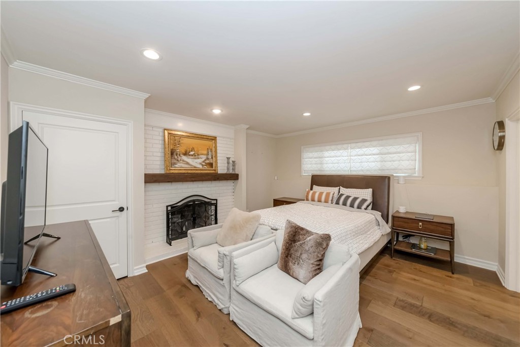 1 Hackamore Road Rolling Hills, CA 90274 - Photo 21 of 57 a bedroom with a bed and a fireplace