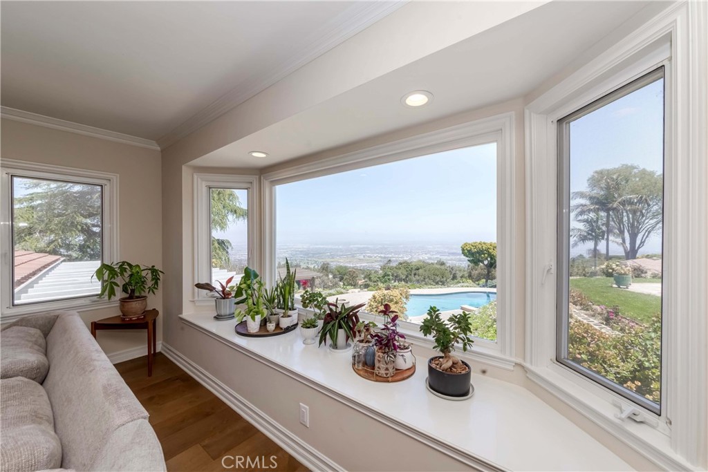 1 Hackamore Road Rolling Hills, CA 90274 - Photo 24 of 57 a view of a living room with furniture and floor to ceiling windows