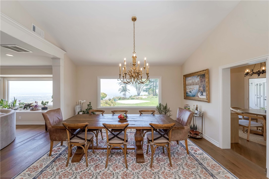 1 Hackamore Road Rolling Hills, CA 90274 - Photo 28 of 57 a view of a dining room with furniture window and wooden floor