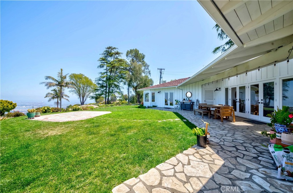 1 Hackamore Road Rolling Hills, CA 90274 - Photo 5 of 57 a front view of a house with garden