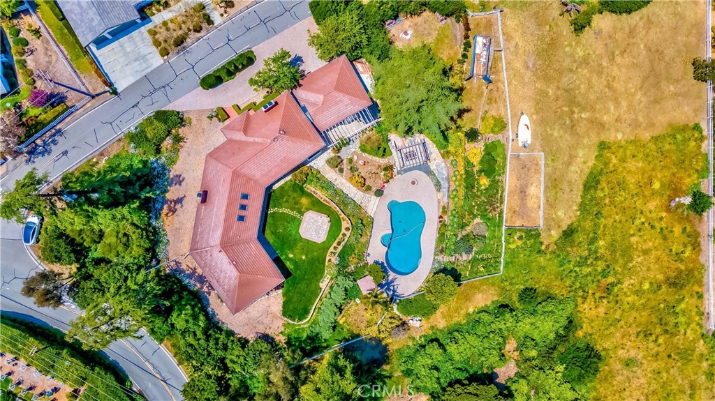1 Hackamore Road Rolling Hills, CA 90274 - Photo 56 of 57 an aerial view of a house with a swimming pool and garden