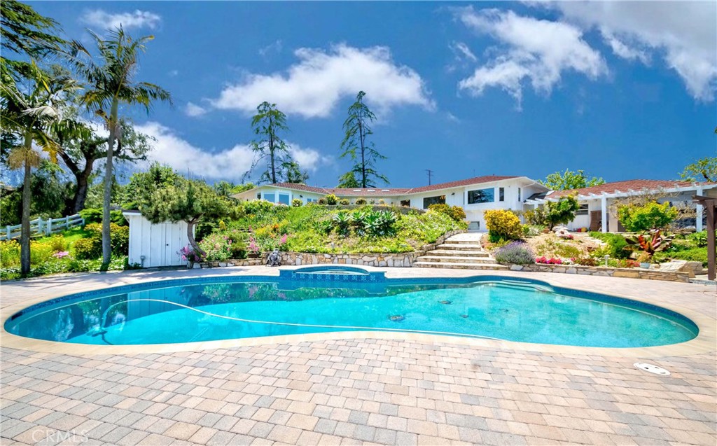 1 Hackamore Road Rolling Hills, CA 90274 - Photo 8 of 57 a view of a swimming pool with a yard