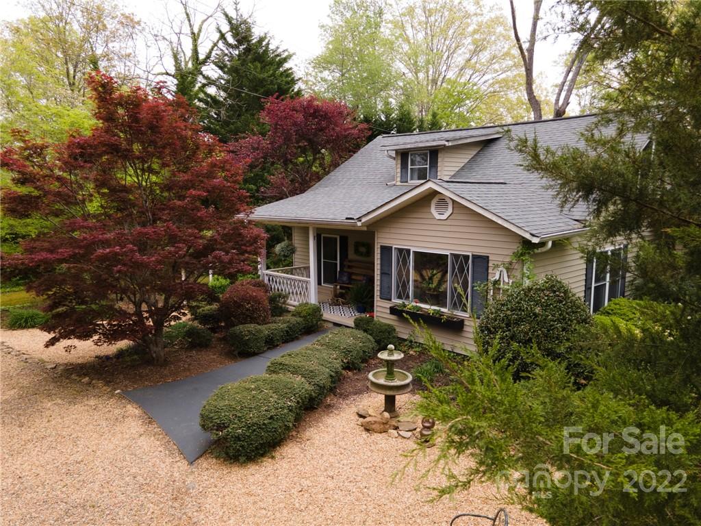 123 Grace Heights Rutherfordton, NC 28139 - Photo 3 of 48 a front view of a house with a yard and garage