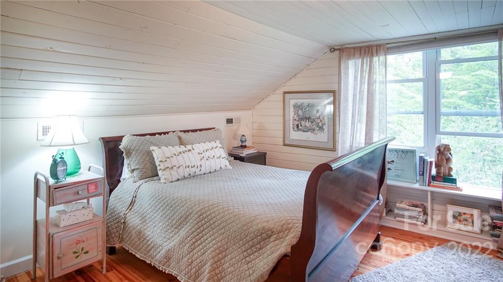 123 Grace Heights Rutherfordton, NC 28139 - Photo 36 of 48 a large bed sitting in a bedroom next to a window