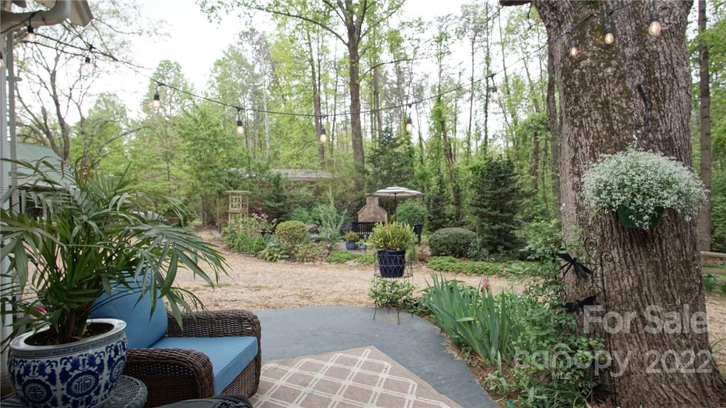 123 Grace Heights Rutherfordton, NC 28139 - Photo 40 of 48 a view of a garden with plants and a bench