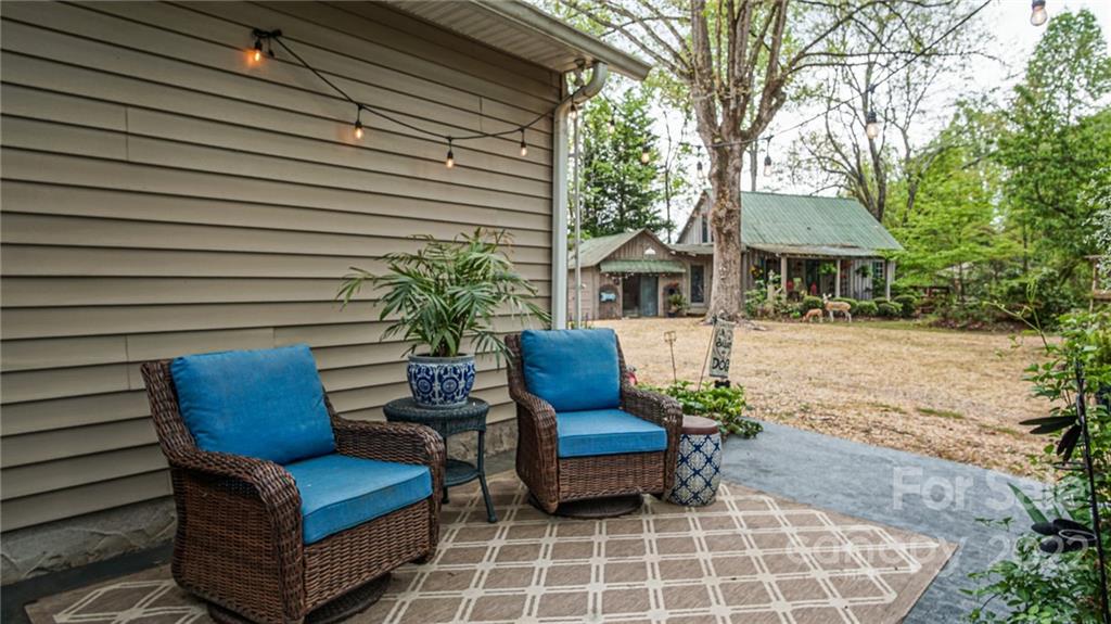 123 Grace Heights Rutherfordton, NC 28139 - Photo 41 of 48 a view of a patio with couches chairs and a fire pit
