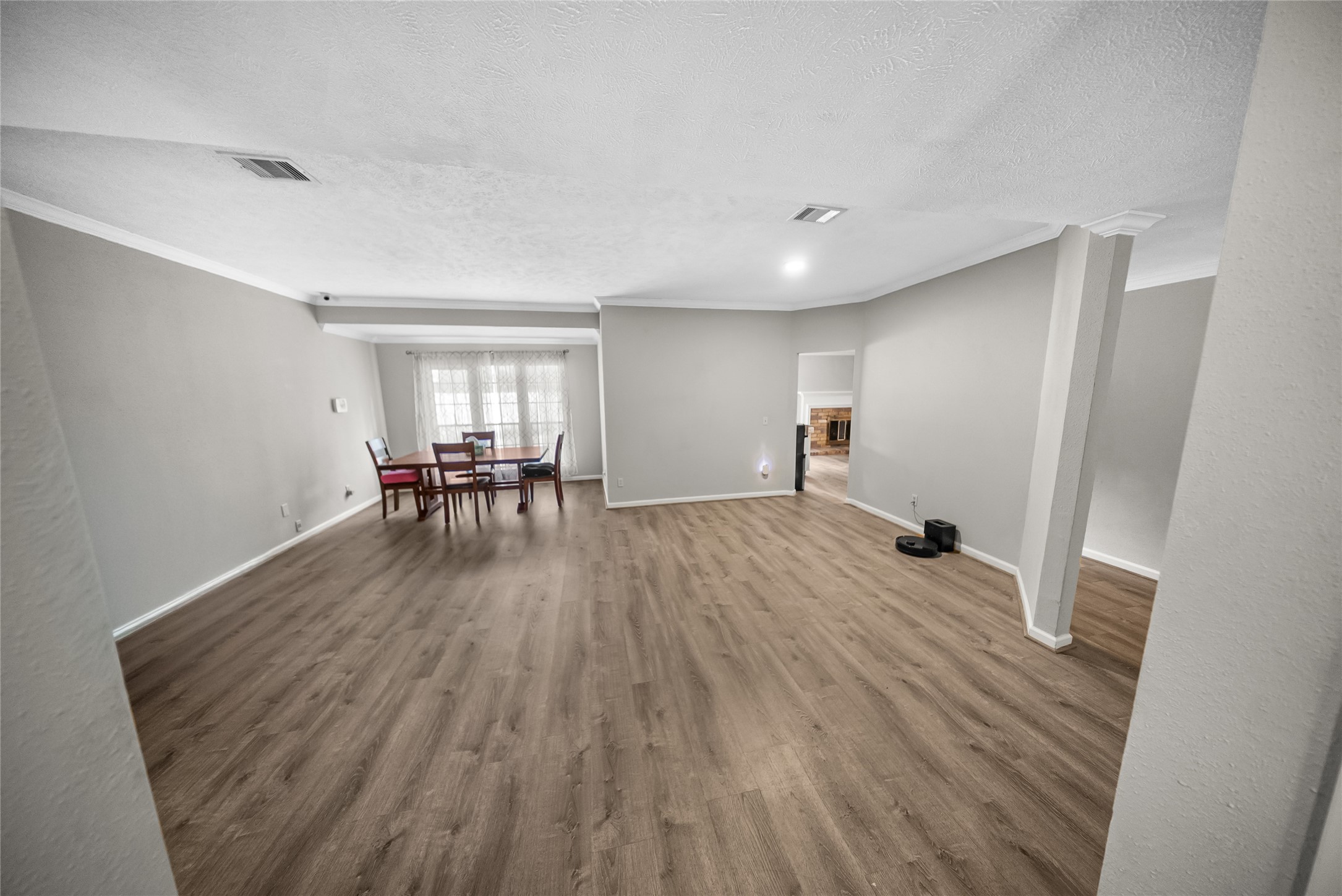9107 Towerstone Court Spring, TX 77379 - Photo 8 of 42 Large and open flex space...use as a formal living room, create a casual living space for TV watching...Dining room niche towards the back.