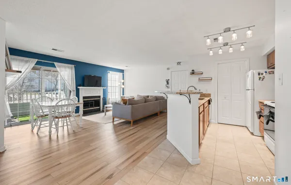 a view of a livingroom with furniture and a fireplace