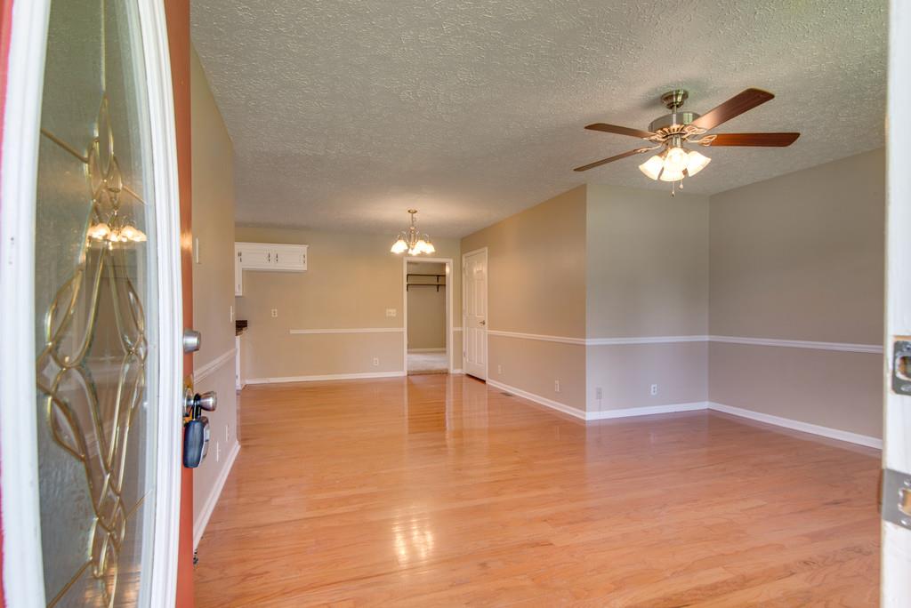7810 Chester Road Fairview, TN 37062 - Photo 2 of 17 a view of empty room with wooden floor