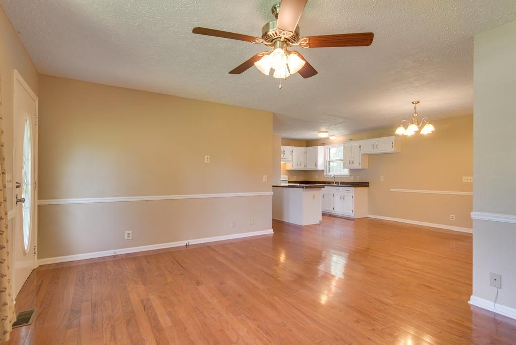 7810 Chester Road Fairview, TN 37062 - Photo 4 of 17 a view of kitchen with livingroom and wooden floor