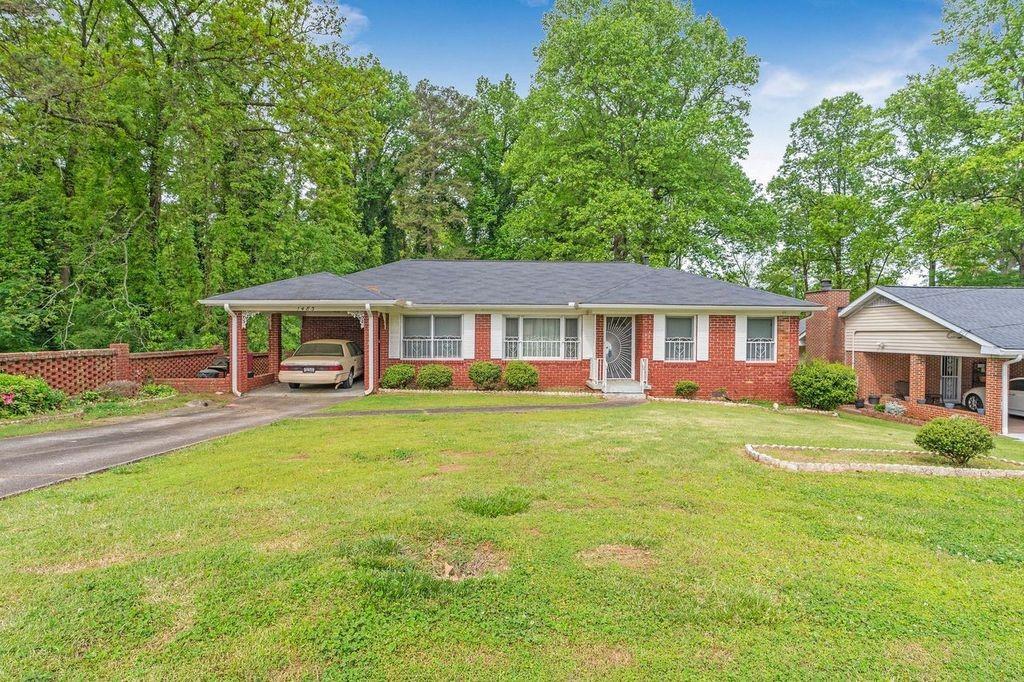 1483 Thomas Road Decatur, GA 30030 - Photo 1 of 1 front view of a house with a yard