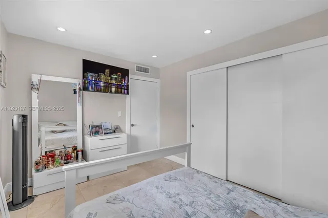 a view of a livingroom with wooden floor and closet