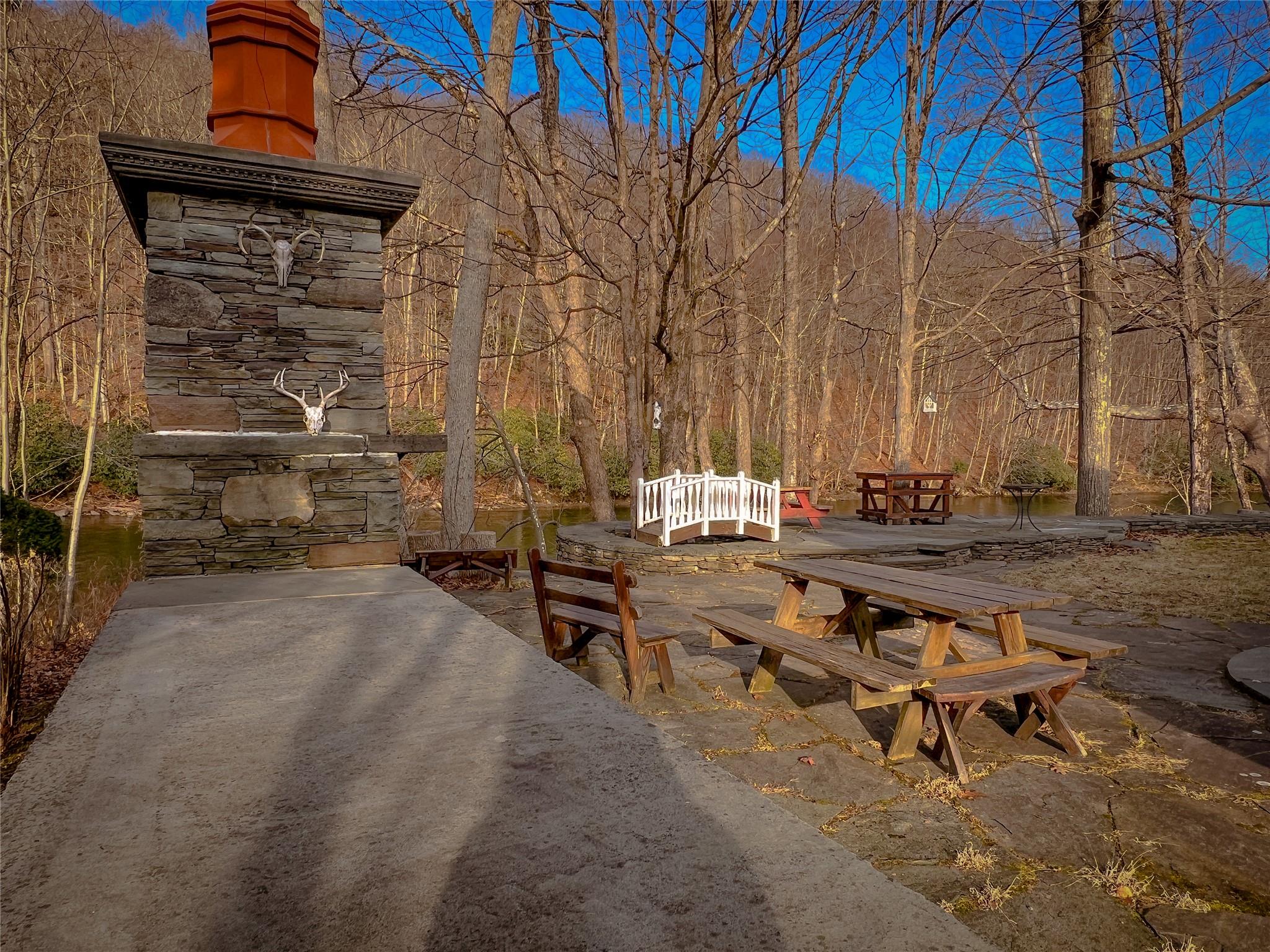 46 Beaverkill Mountain Road Roscoe, NY 12776 - Photo 11 of 27 a backyard of a house with outdoor seating