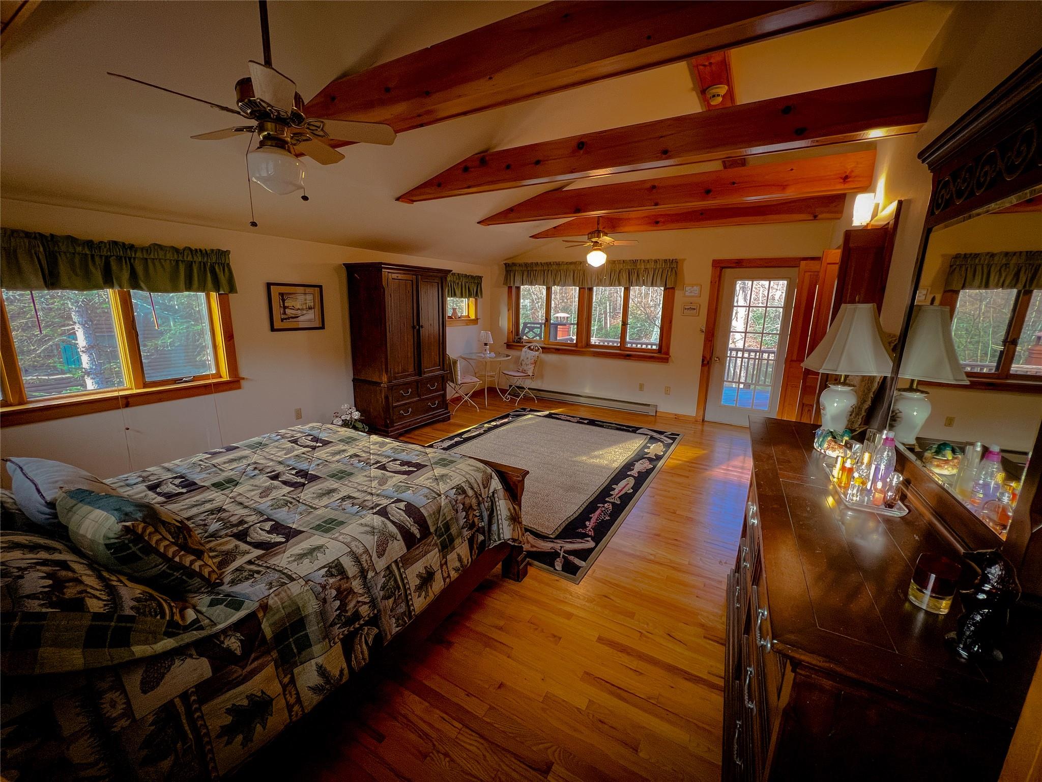 46 Beaverkill Mountain Road Roscoe, NY 12776 - Photo 14 of 27 a bed sitting in a bedroom next to a window