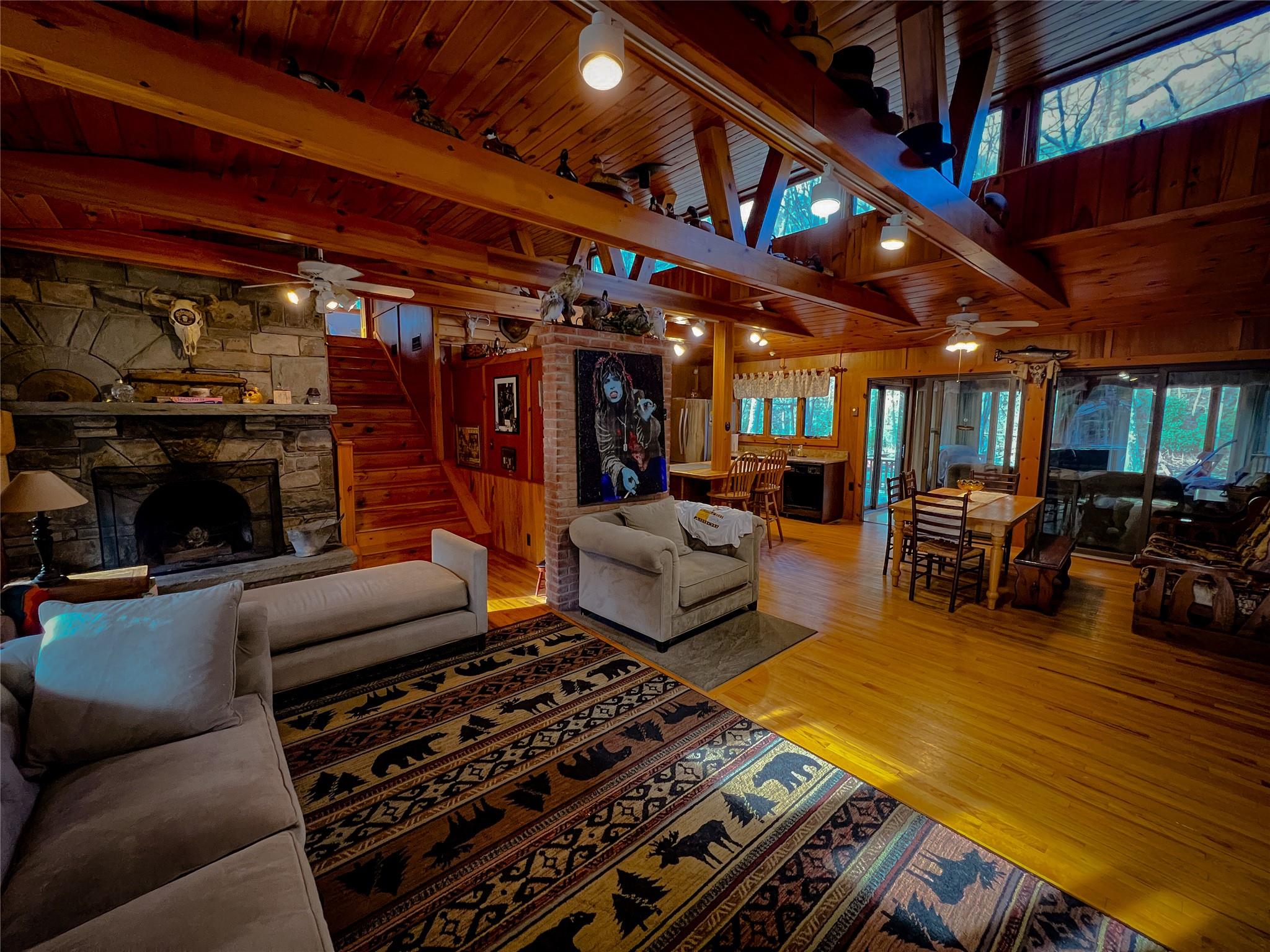 46 Beaverkill Mountain Road Roscoe, NY 12776 - Photo 17 of 27 a living room with furniture a flat screen tv and a fireplace