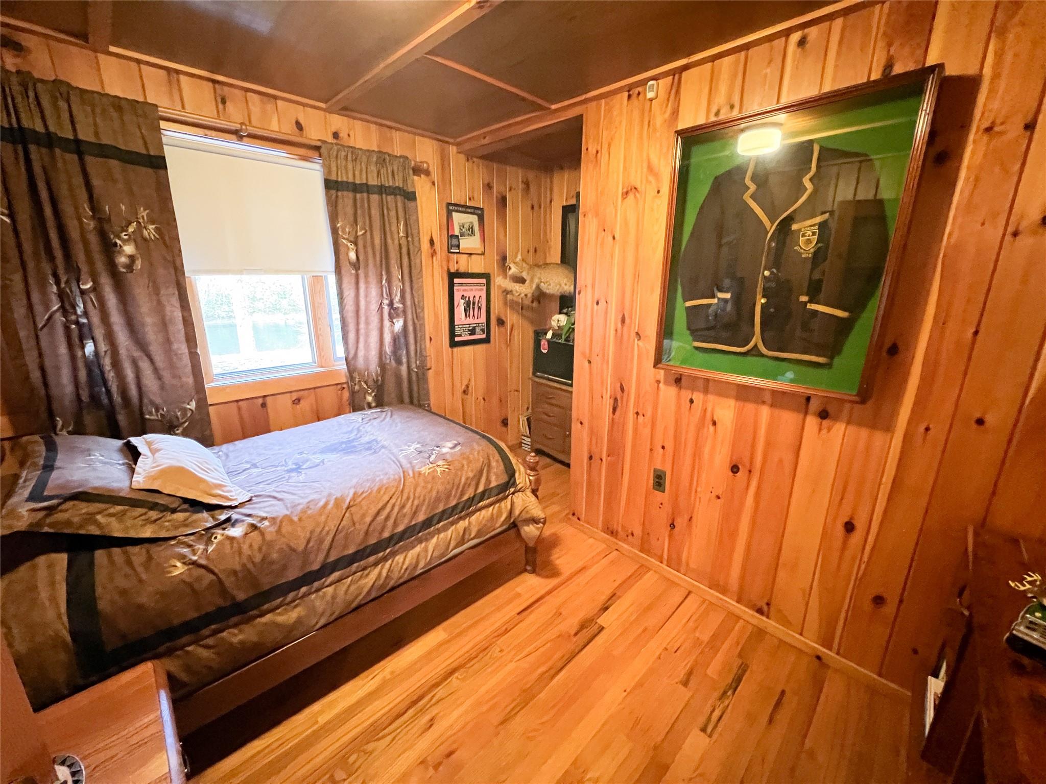 46 Beaverkill Mountain Road Roscoe, NY 12776 - Photo 19 of 27 a bedroom with a bed and a mirror
