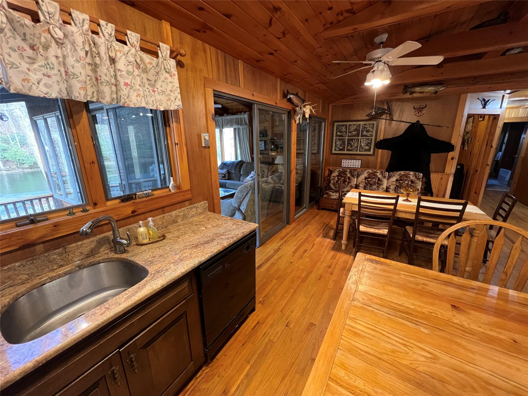 46 Beaverkill Mountain Road Roscoe, NY 12776 - Photo 22 of 27 a view of a kitchen counter space with furniture and wooden floor