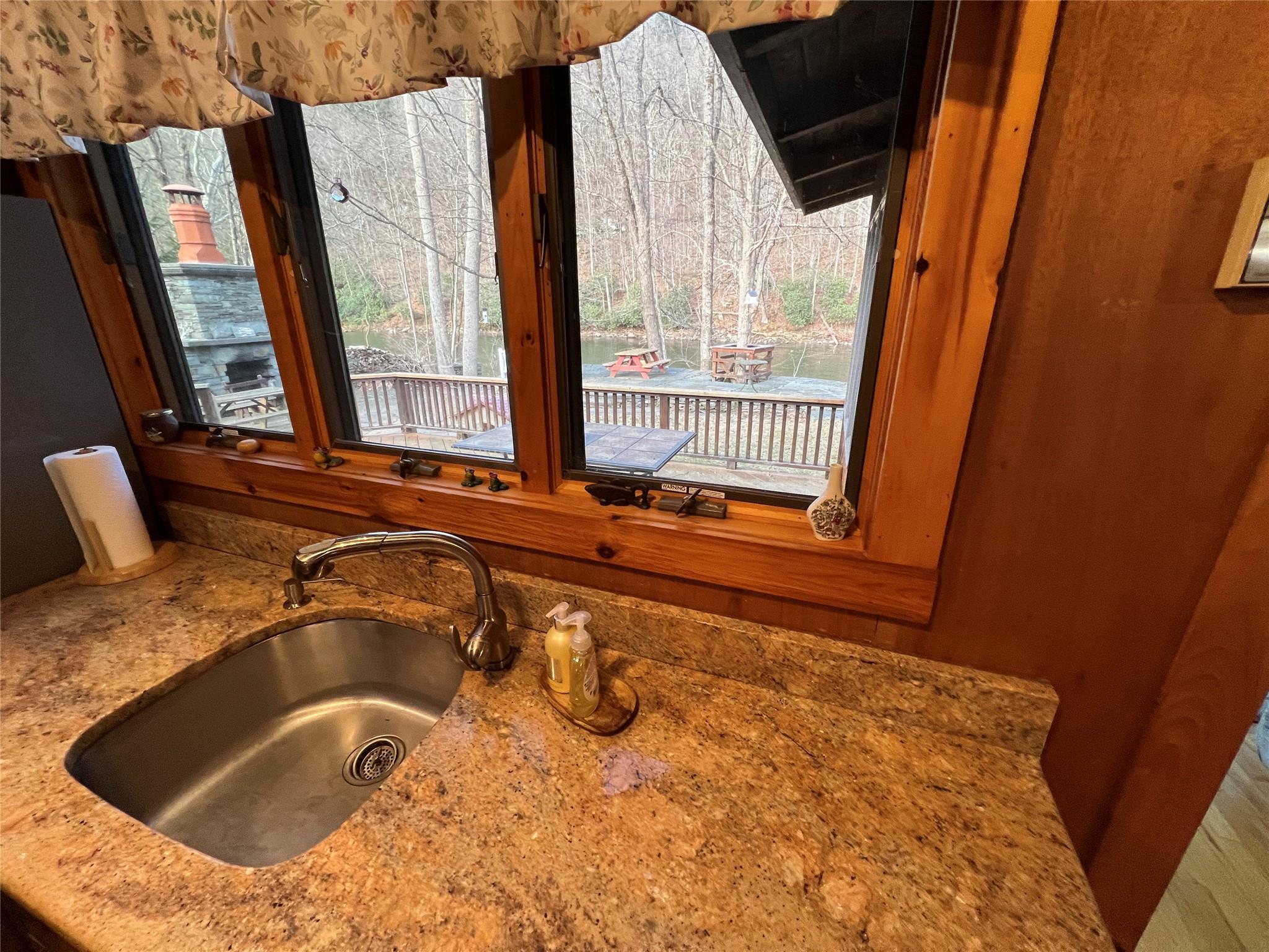 46 Beaverkill Mountain Road Roscoe, NY 12776 - Photo 23 of 27 a bathroom with a granite countertop sink and a large mirror