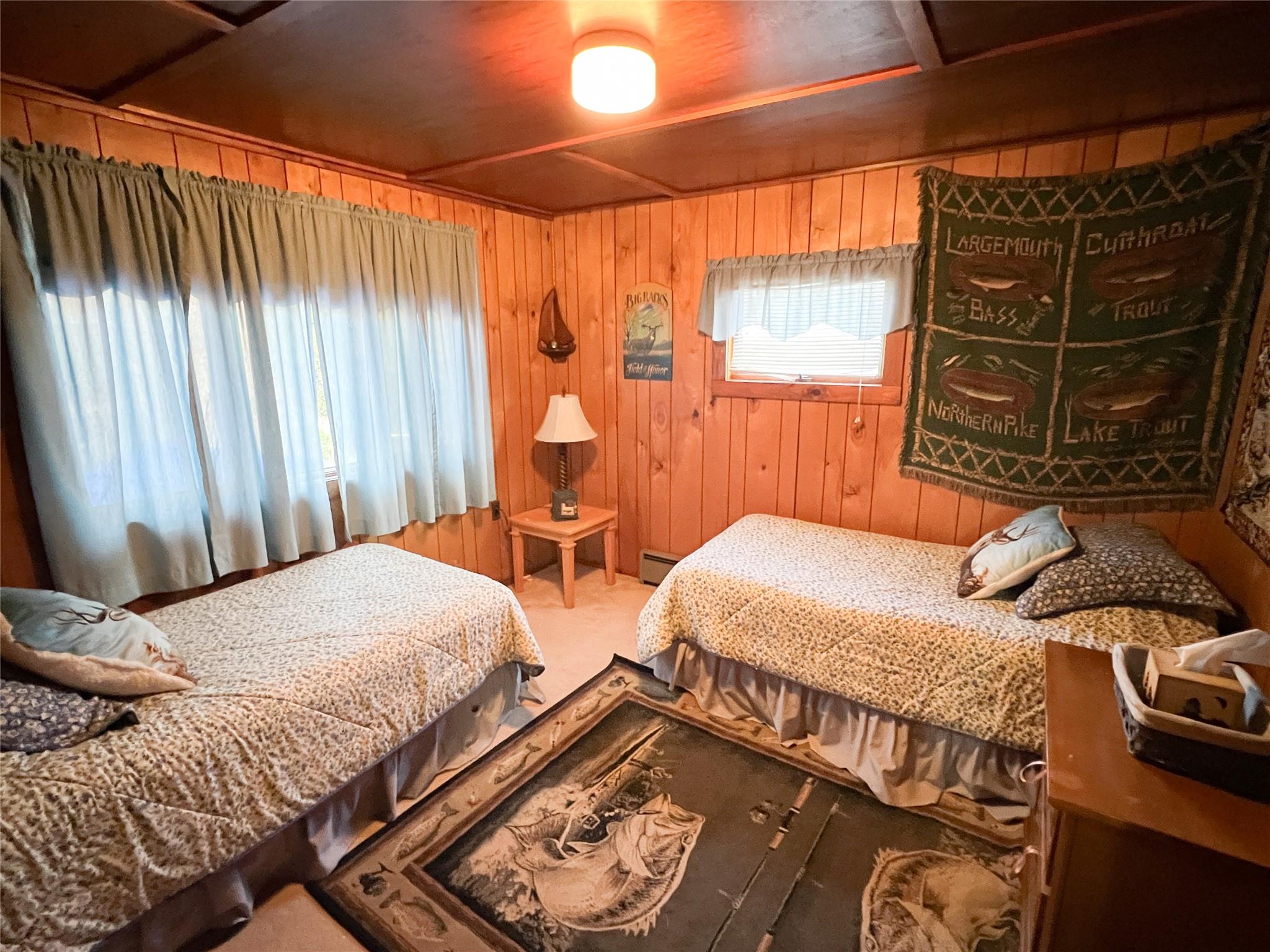 46 Beaverkill Mountain Road Roscoe, NY 12776 - Photo 25 of 27 a bedroom with two beds and a window