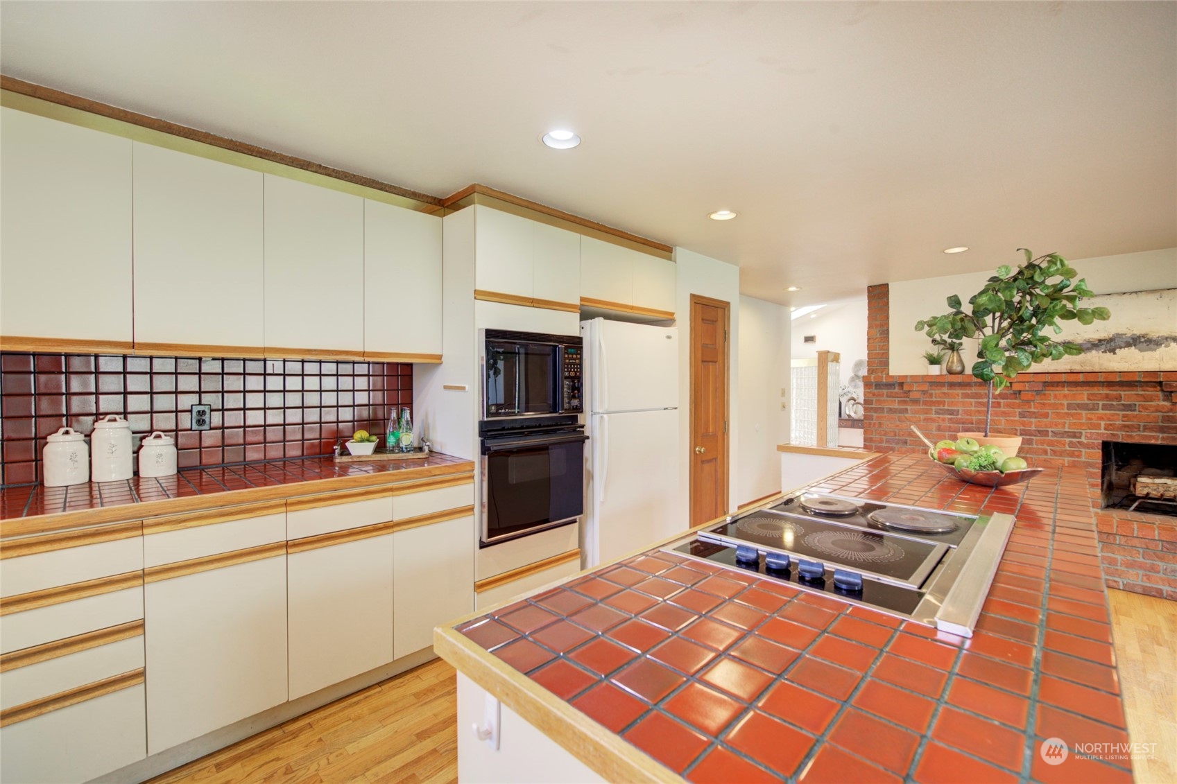 925 Riverside Drive Southeast North Bend, WA 98045 - Photo 11 of 30 a kitchen with sink refrigerator and stove