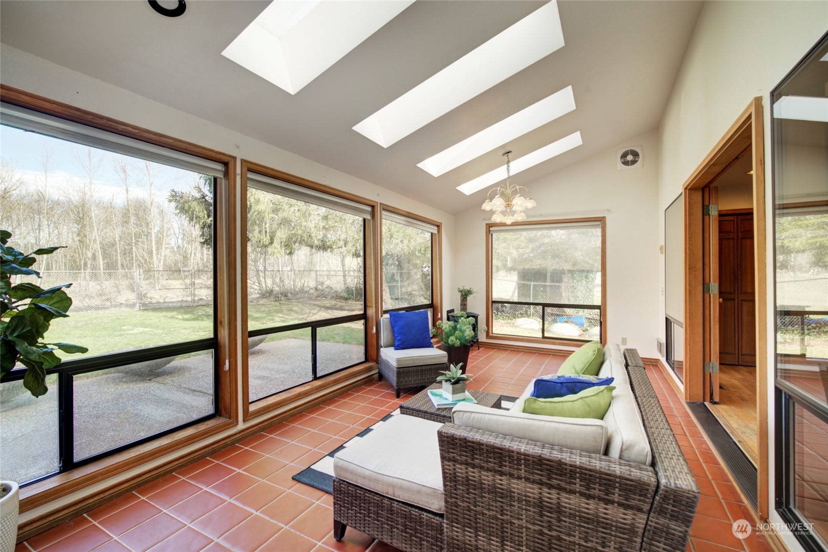 925 Riverside Drive Southeast North Bend, WA 98045 - Photo 13 of 30 a living room with furniture and a floor to ceiling window