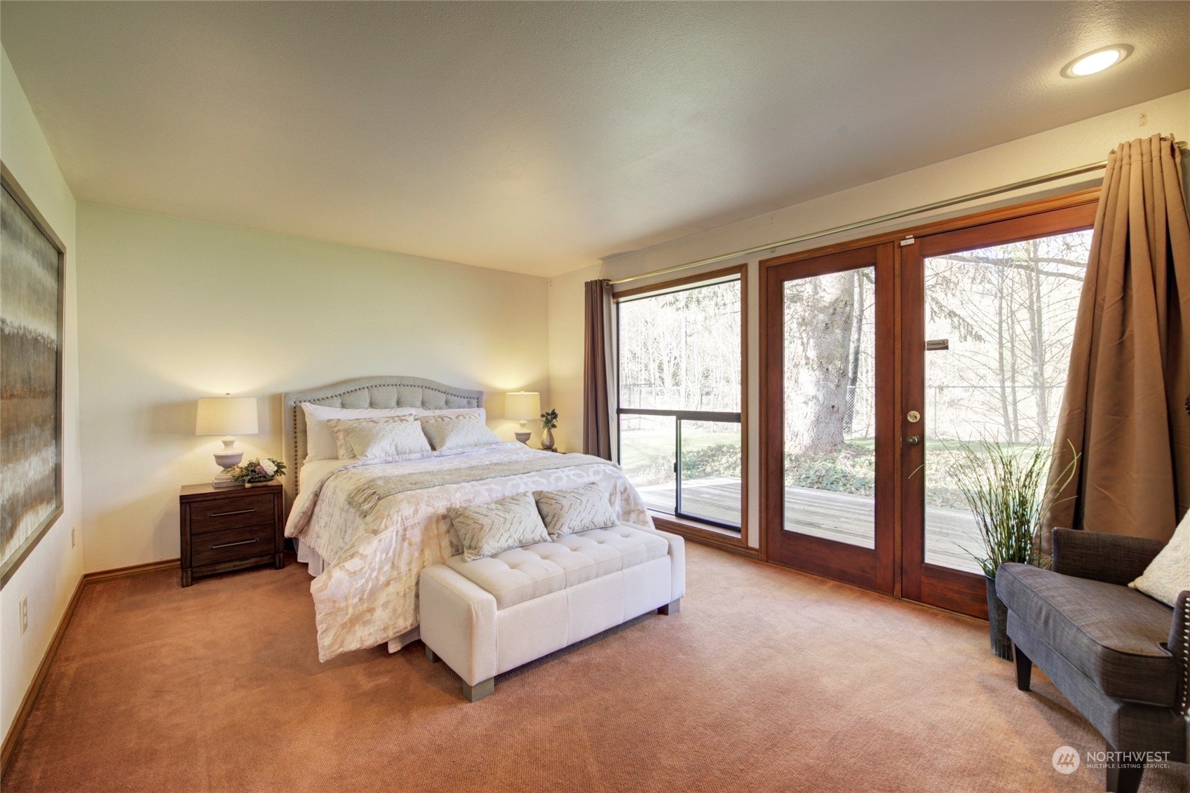 925 Riverside Drive Southeast North Bend, WA 98045 - Photo 14 of 30 a bedroom with a bed and a large window
