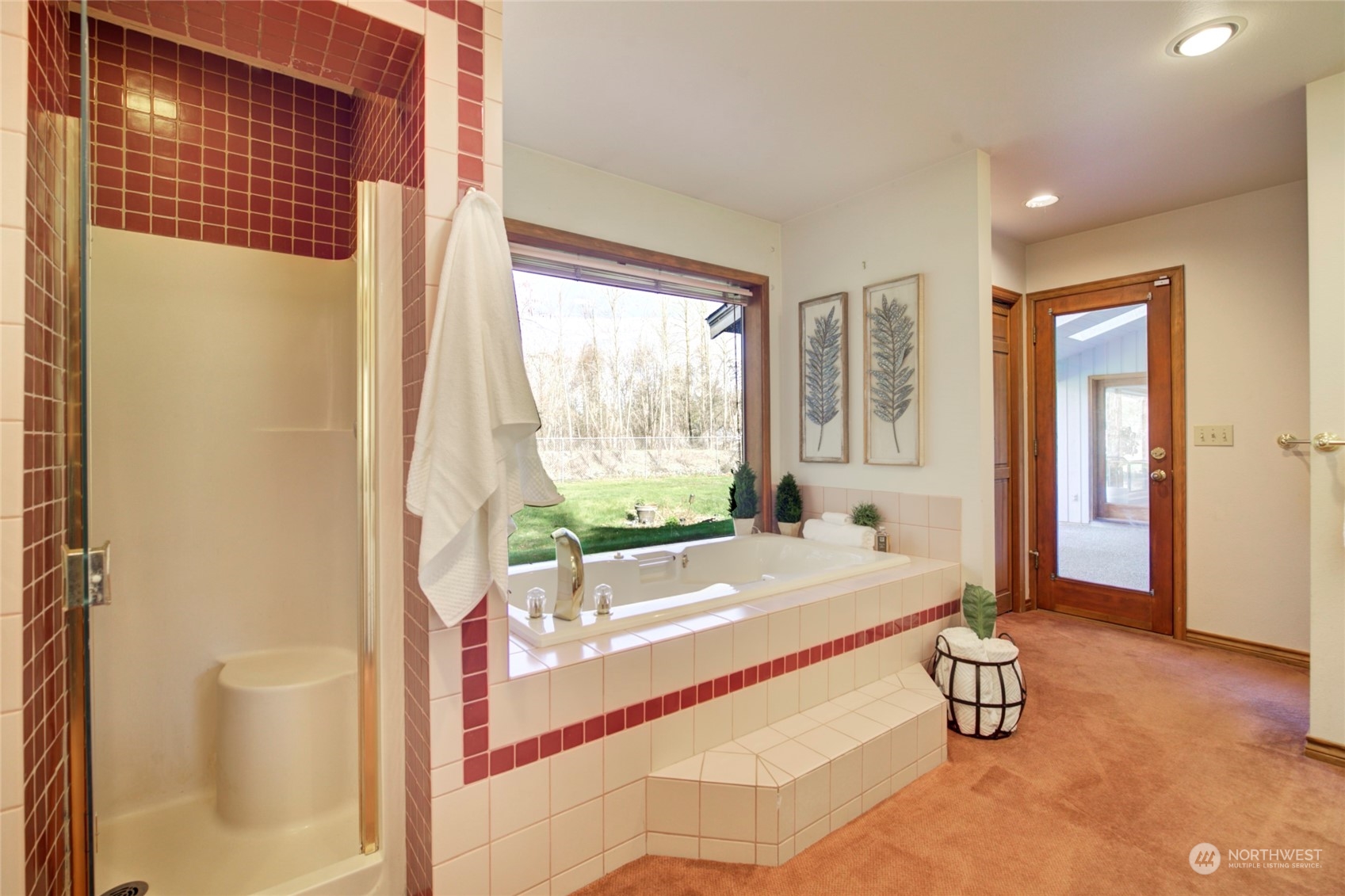 925 Riverside Drive Southeast North Bend, WA 98045 - Photo 16 of 30 a spacious bathroom with a tub sink and mirror