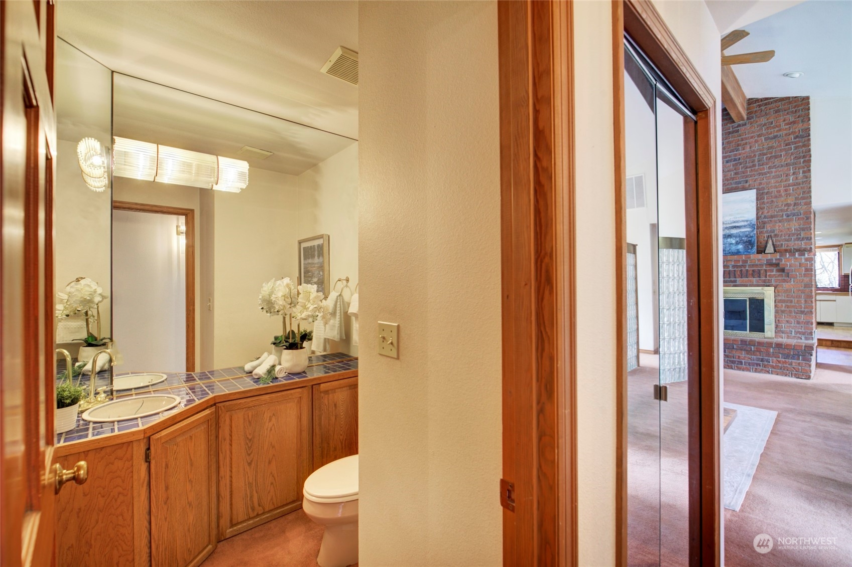925 Riverside Drive Southeast North Bend, WA 98045 - Photo 19 of 30 a bathroom with a granite countertop sink toilet and shower
