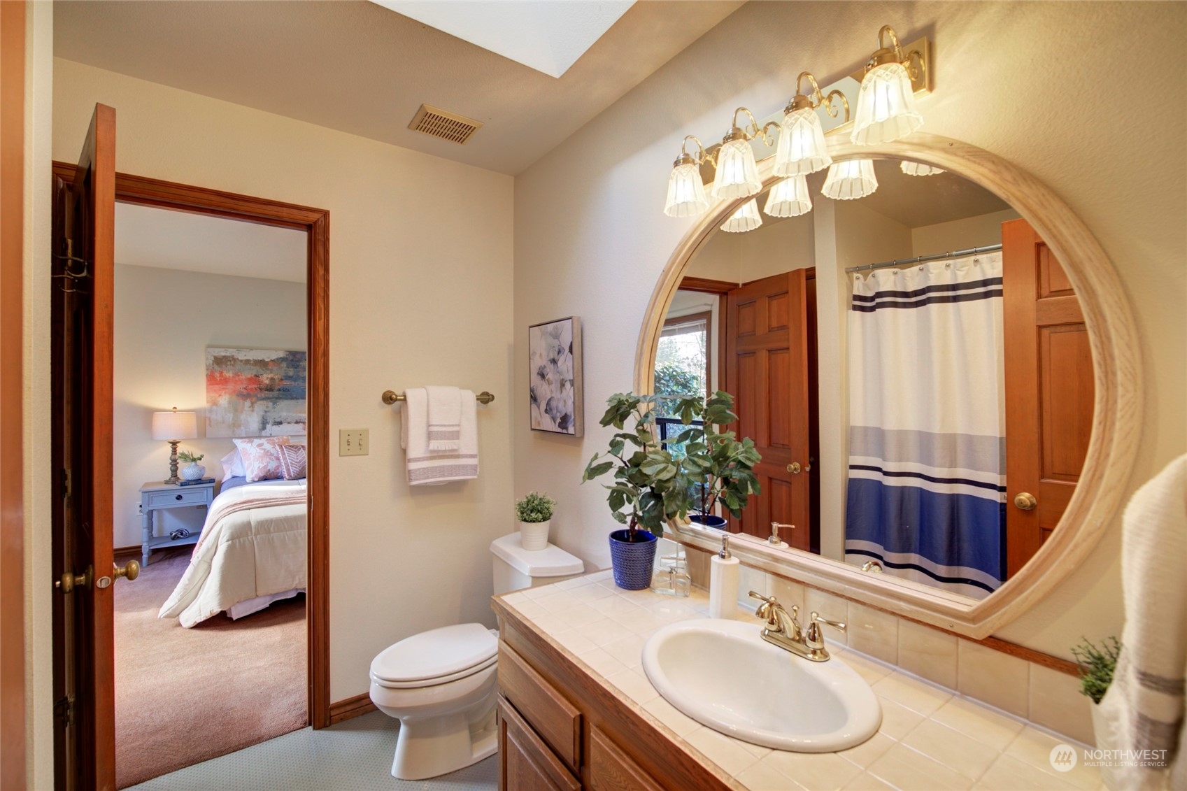 925 Riverside Drive Southeast North Bend, WA 98045 - Photo 22 of 30 a bathroom with a sink a toilet and a mirror