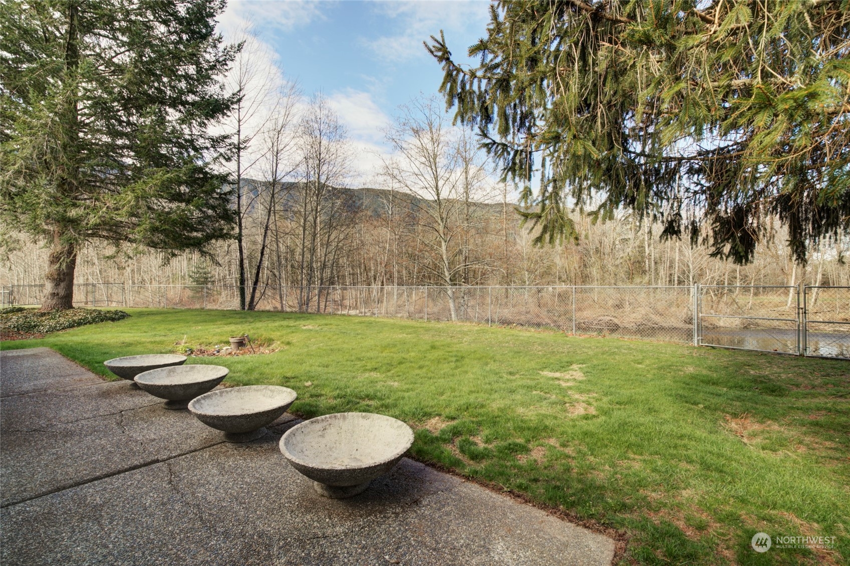 925 Riverside Drive Southeast North Bend, WA 98045 - Photo 25 of 30 a view of a table and chairs in the garden