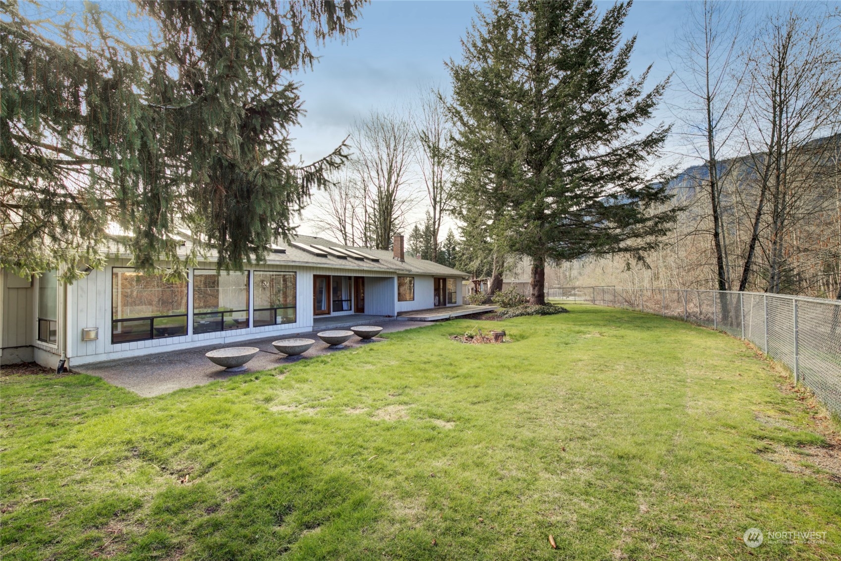 925 Riverside Drive Southeast North Bend, WA 98045 - Photo 26 of 30 a view of a house with swimming pool and sitting area