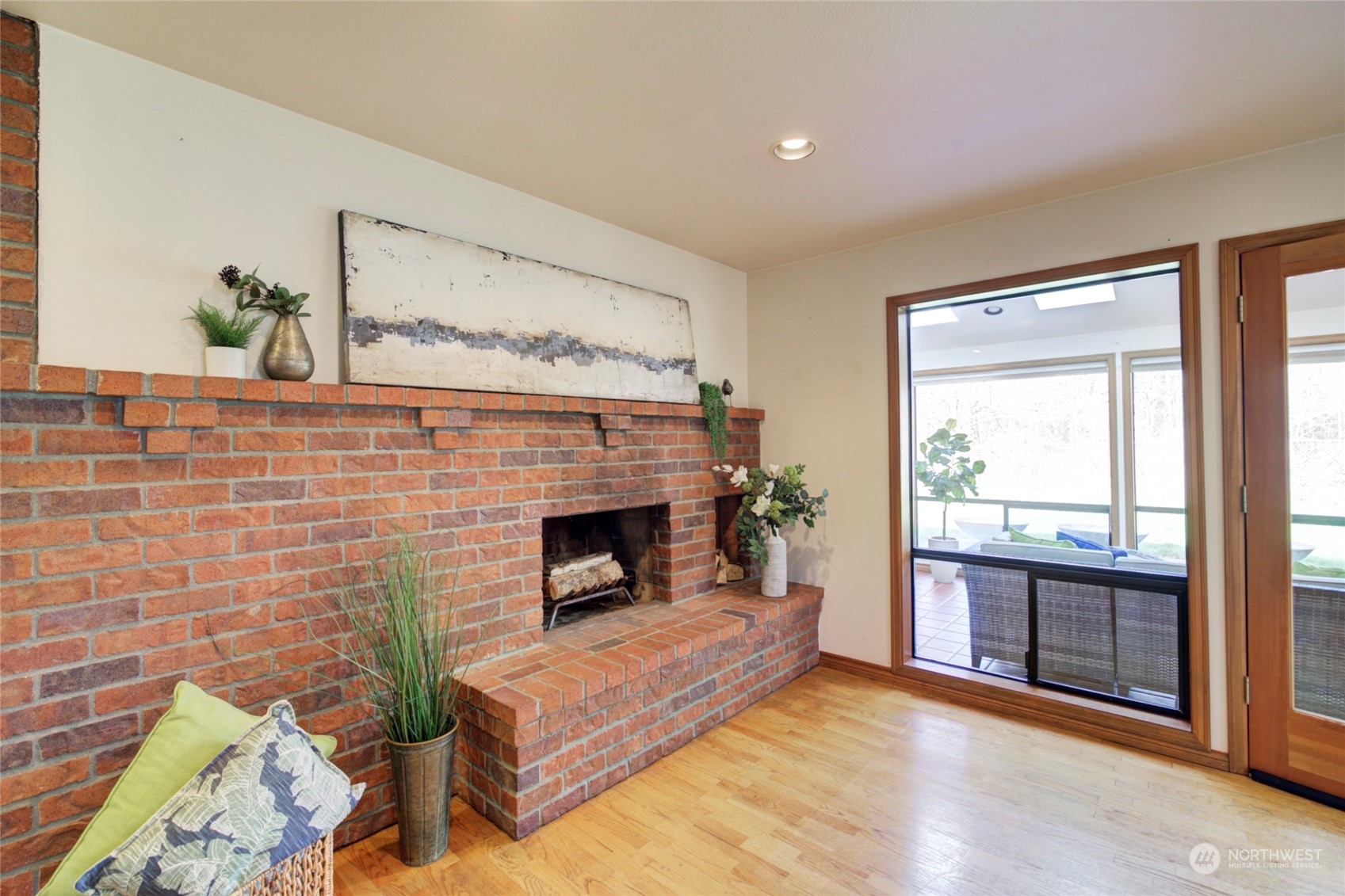 925 Riverside Drive Southeast North Bend, WA 98045 - Photo 10 of 30 a living room with furniture and a fireplace