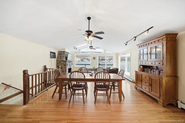 a view of a dining room with furniture window and wooden floor