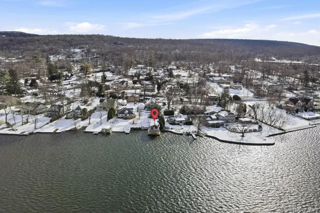 an aerial view of a house with a mountain view