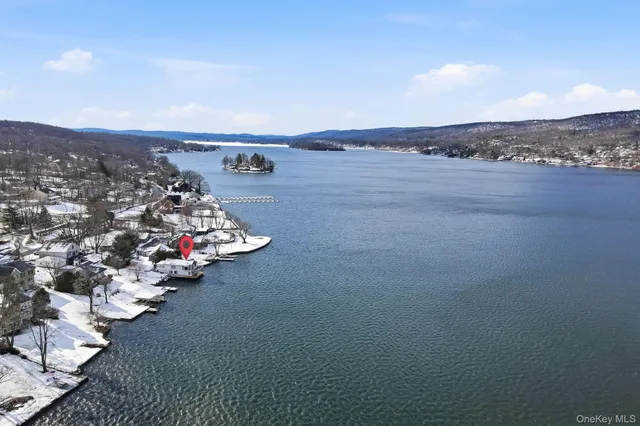 wooden floor with a water view