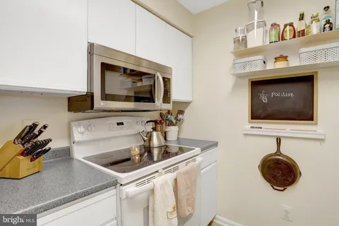 a kitchen with a stove and a microwave