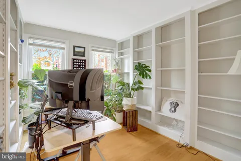 a workspace with furniture and a potted plant