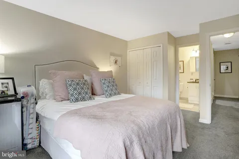 a bedroom with a bed and a table