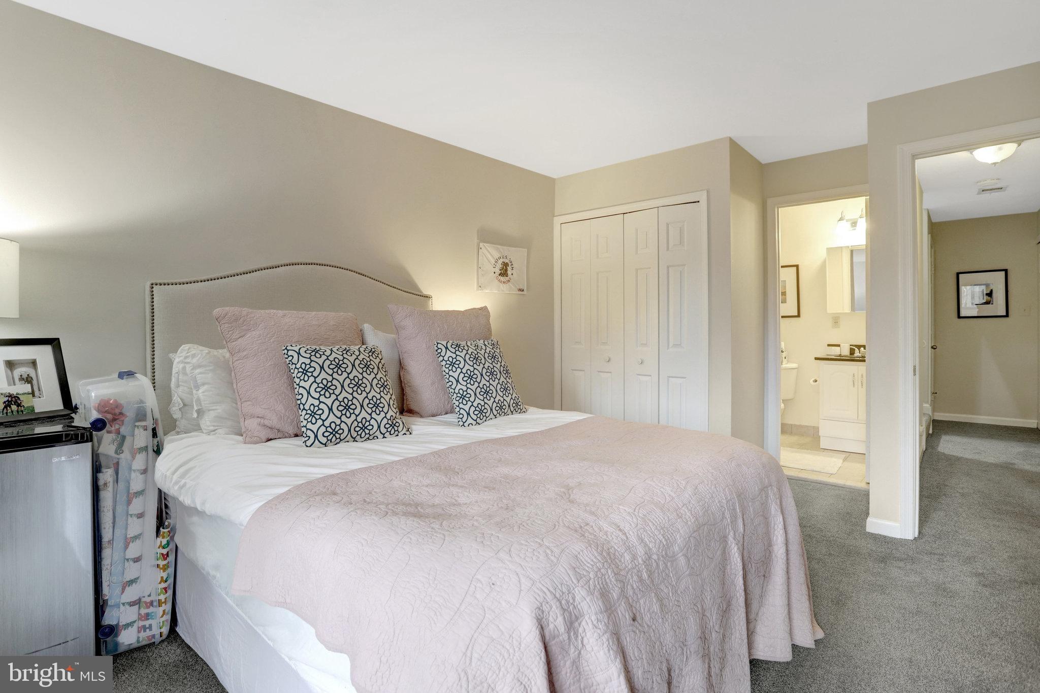 2101 North Rolfe Street, Unit C Arlington, VA 22209 - Photo 19 of 26 a bedroom with a bed and a table