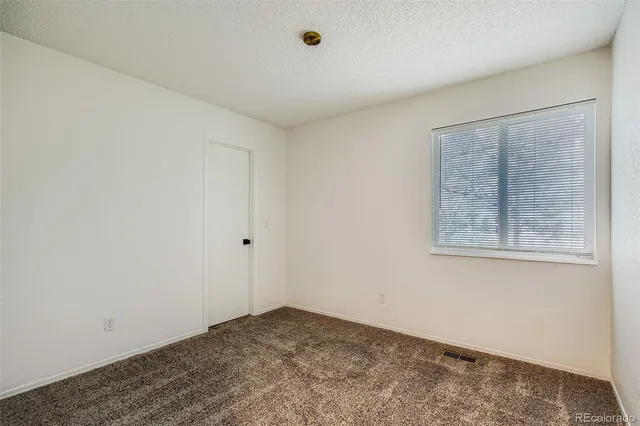 a view of a room that has a window in it