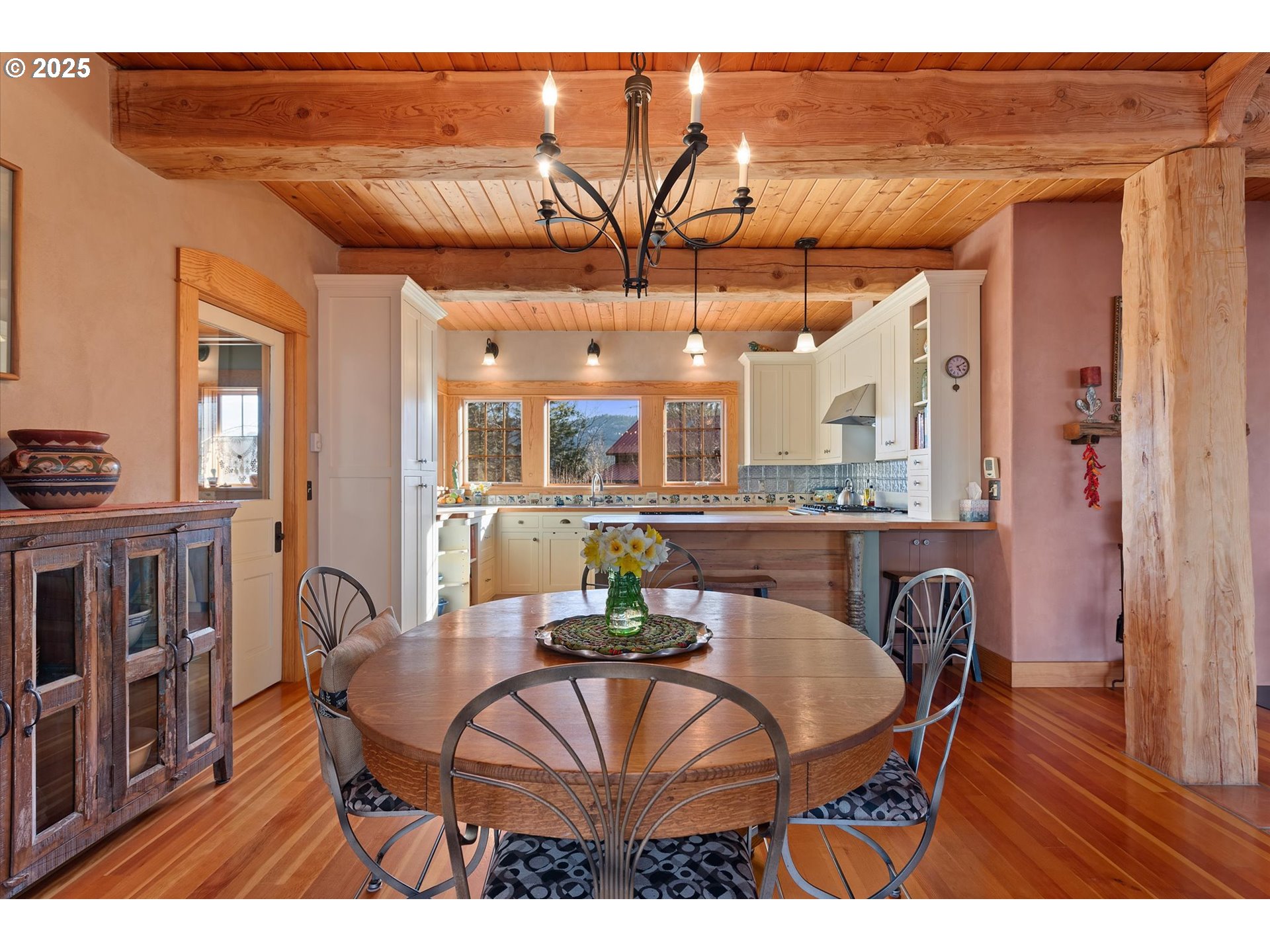 48303 Cornucopia Highway Halfway, OR 97834 - Photo 17 of 48 a view of a dining room with furniture and a chandelier