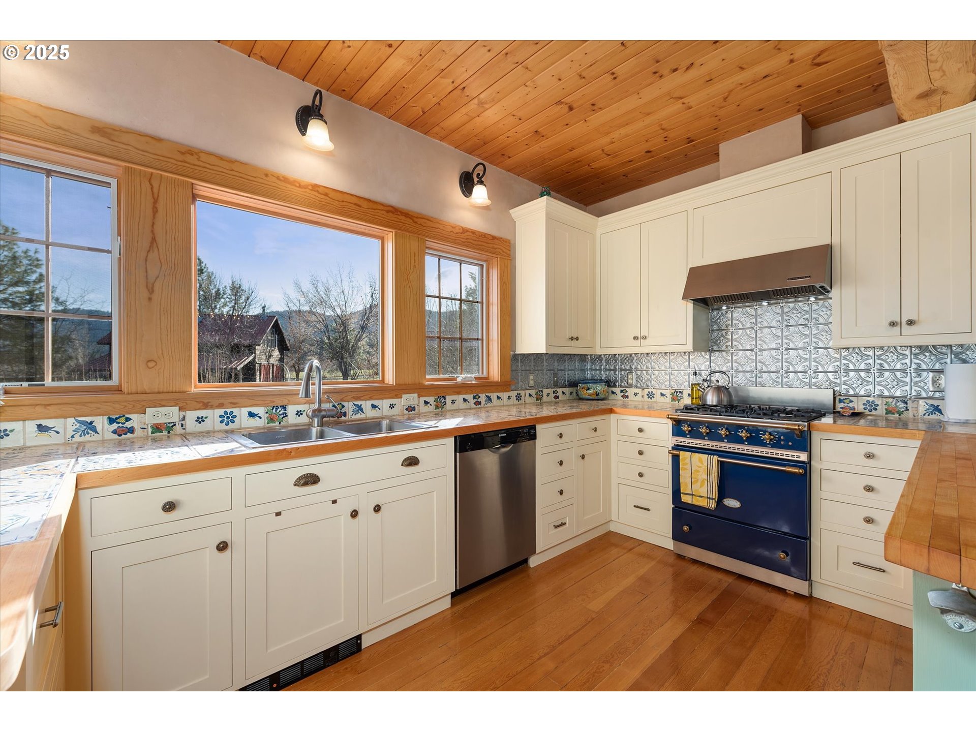 48303 Cornucopia Highway Halfway, OR 97834 - Photo 21 of 48 a kitchen with granite countertop a sink stainless steel appliances and cabinets