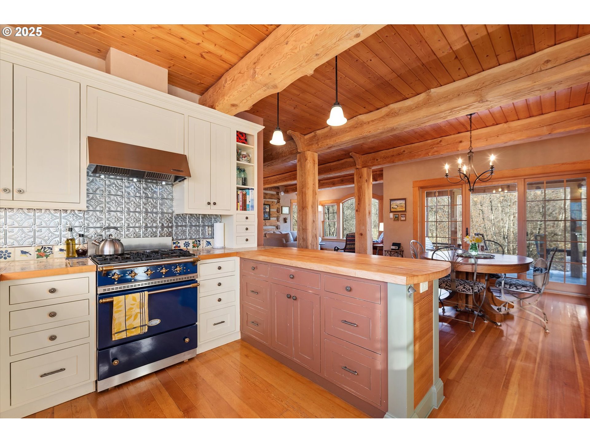 48303 Cornucopia Highway Halfway, OR 97834 - Photo 22 of 48 a kitchen with stainless steel appliances granite countertop a stove a sink dishwasher and white cabinets with wooden floor
