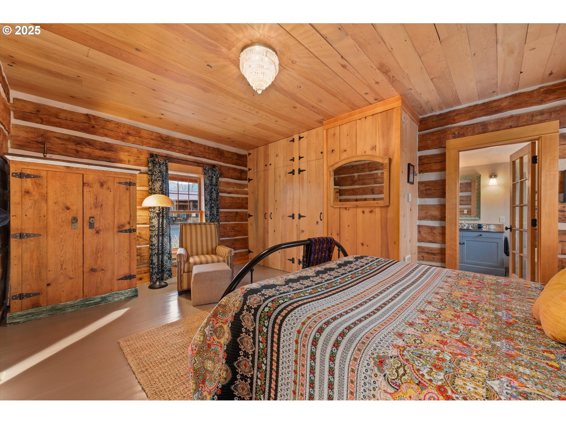 48303 Cornucopia Highway Halfway, OR 97834 - Photo 25 of 48 a bedroom with a bed and dresser with mirror