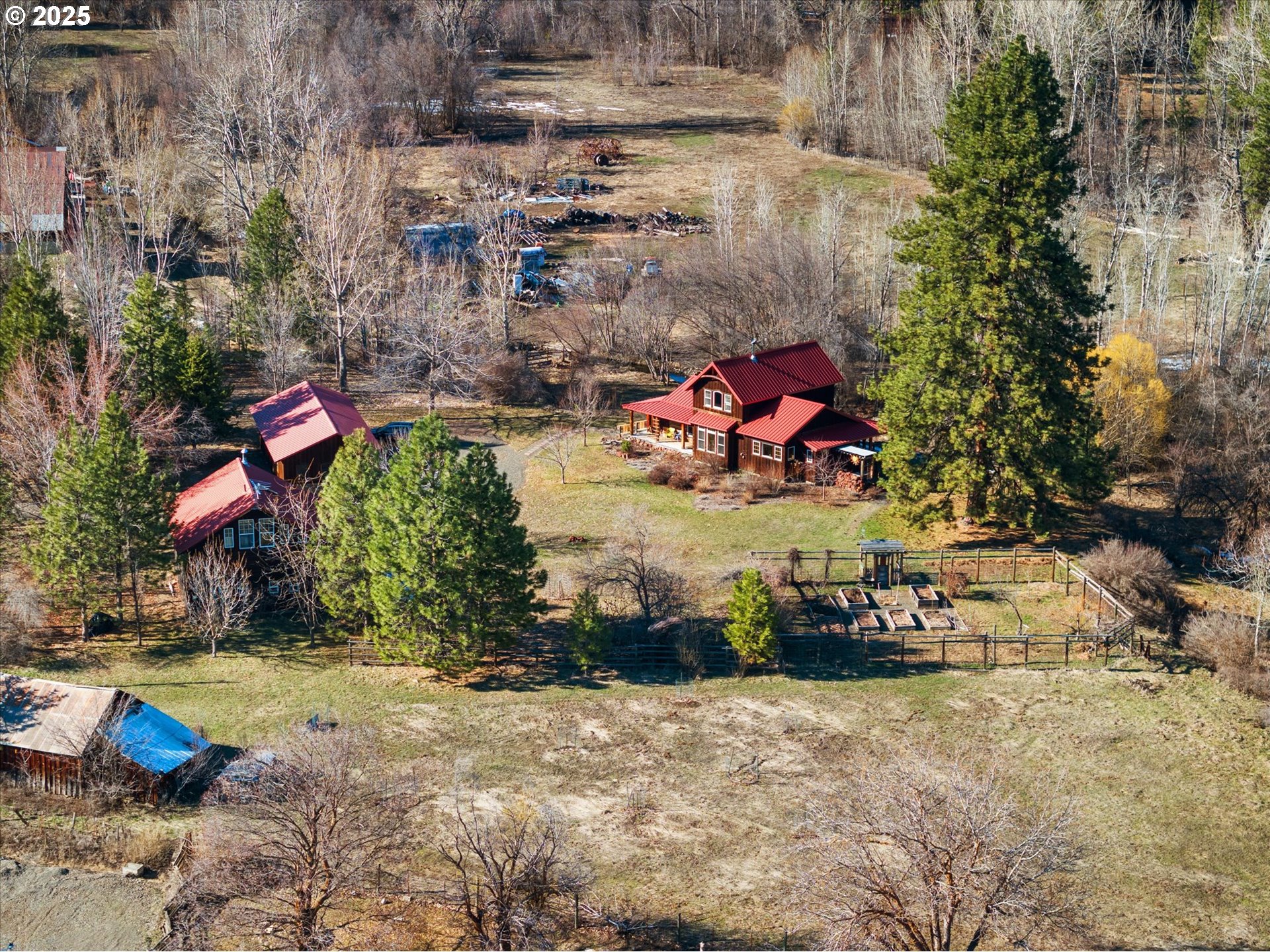 48303 Cornucopia Highway Halfway, OR 97834 - Photo 3 of 48 a backyard of a house with lots of green space and fountain