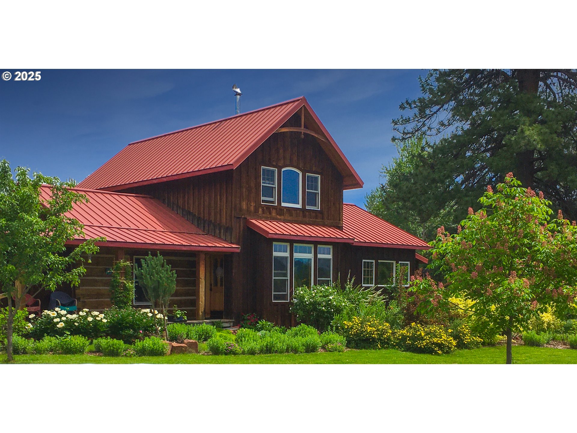 48303 Cornucopia Highway Halfway, OR 97834 - Photo 6 of 48 a view of a house with a yard and potted plants