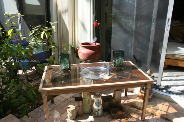 a bedroom with a bed and a plant