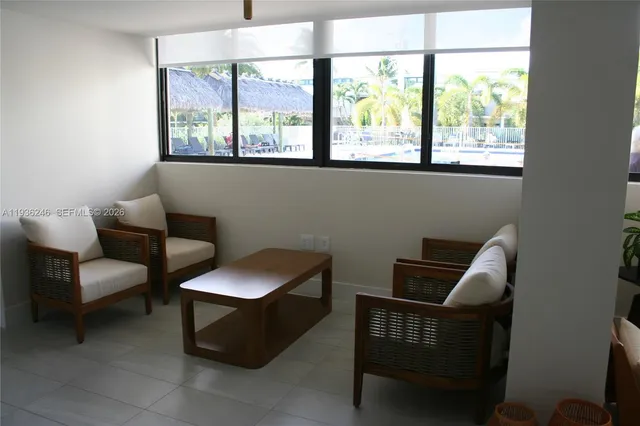 a living room with furniture and a window