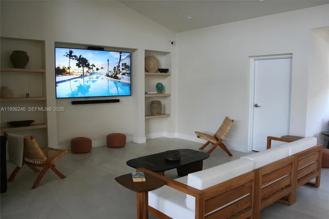 a room with furniture and air hockey table