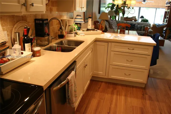 a kitchen with a sink and cabinets